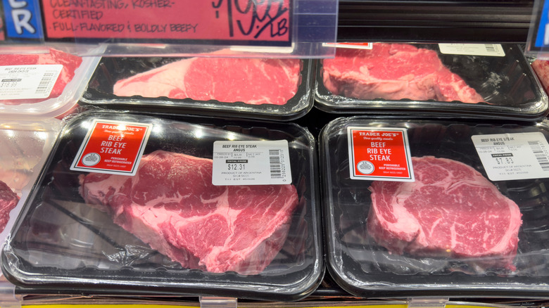 Packages of ribeye steak sit in a cooler at Trader Joe's