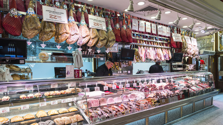 A butcher counter with a variety of meats