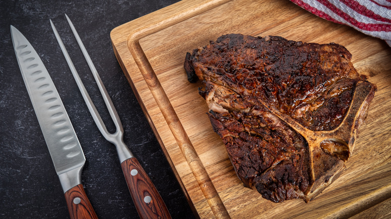 Cooked steak resting on a cutting board