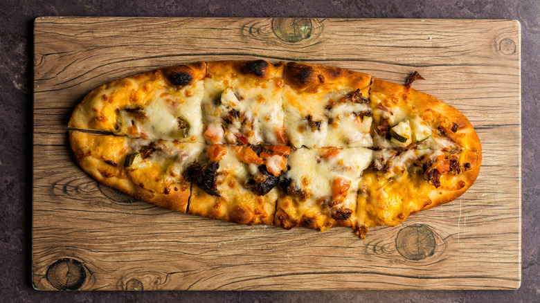 Brisket flatbread on a wooden board