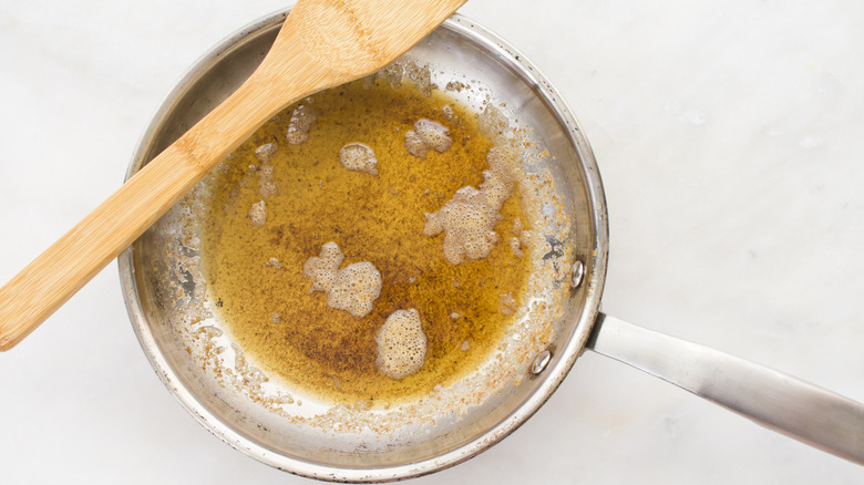Melted brown butter in stainless steel skillet