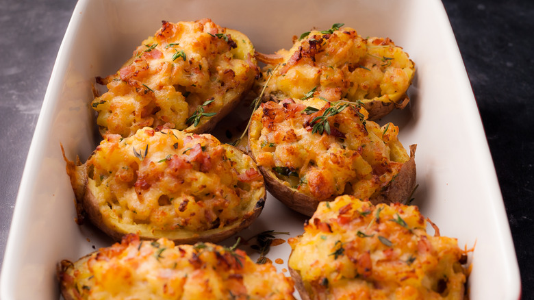 Twice baked potatoes in a white casserole