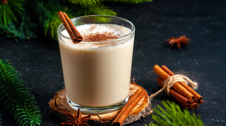 egg nog with cinnamon sticks