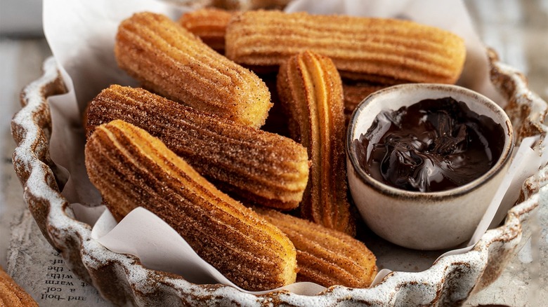 plate churros with chocolate sauce