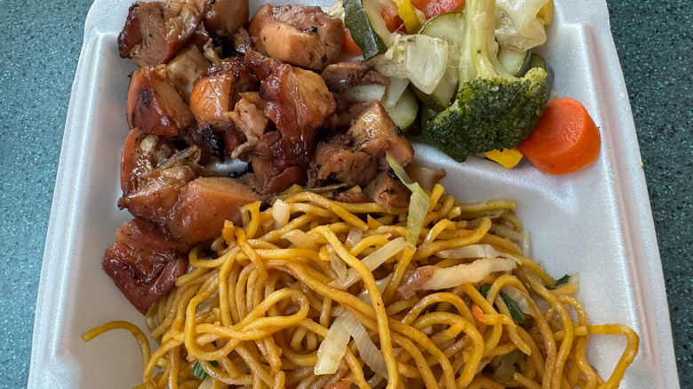 Food court bourbon chicken with noodles and vegetables.