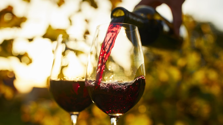 red wine being poured into glasses