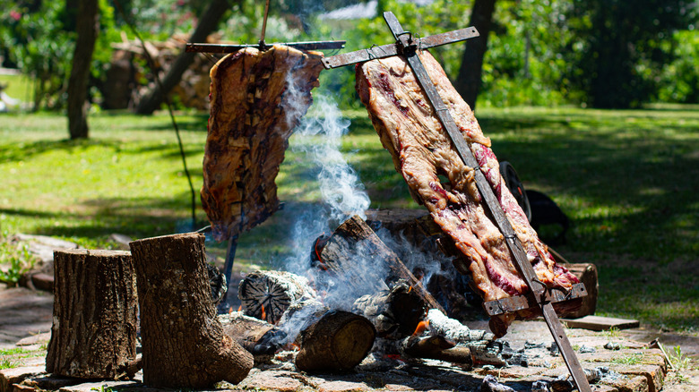 Traditional Argentinian asado cooking over a fire