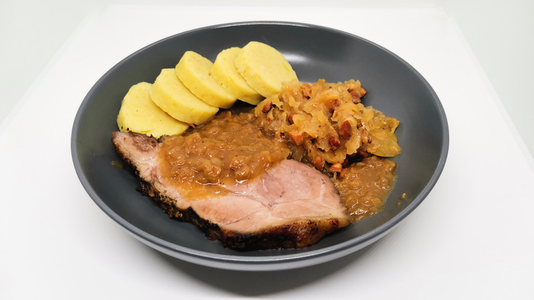 Czechian roasted pork with sauerkraut and dumplings