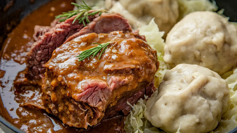 German Sauerbraten with braised meat, gravy, and potato dumplings