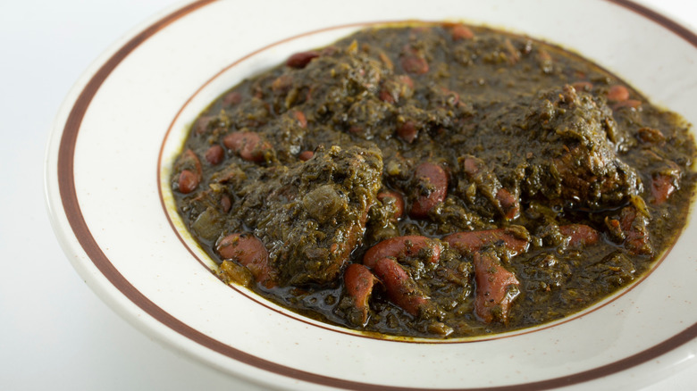 Bowl of traditional Persian Ghormeh Sabzi with lamb and kidney beans