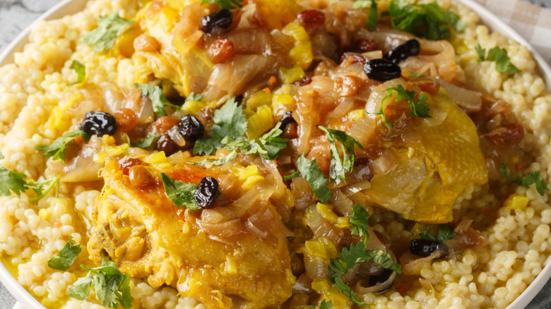 Plate of Moroccan couscous with chicken, raisins, and onions