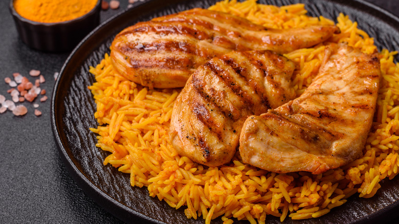 Traditional kabsa dish with chicken, rice, and spices