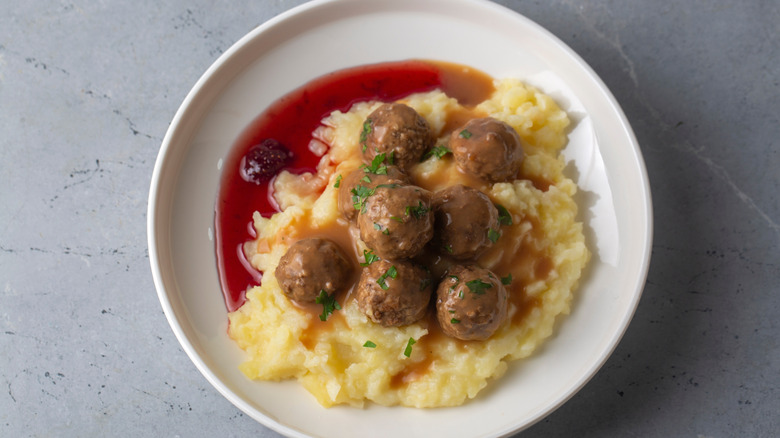 Plate of Swedish meatballs with mashed potatoes and lingonberry sauce