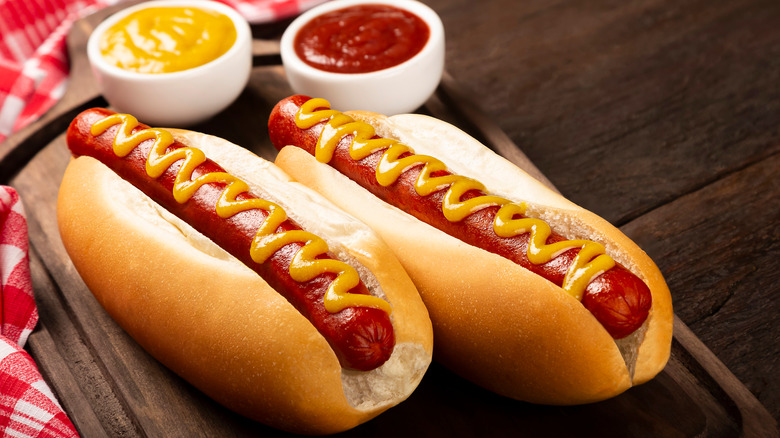 hot dogs with mustard toppings