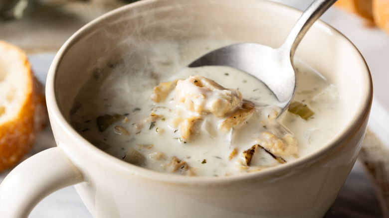 A mug of steaming clam chowder