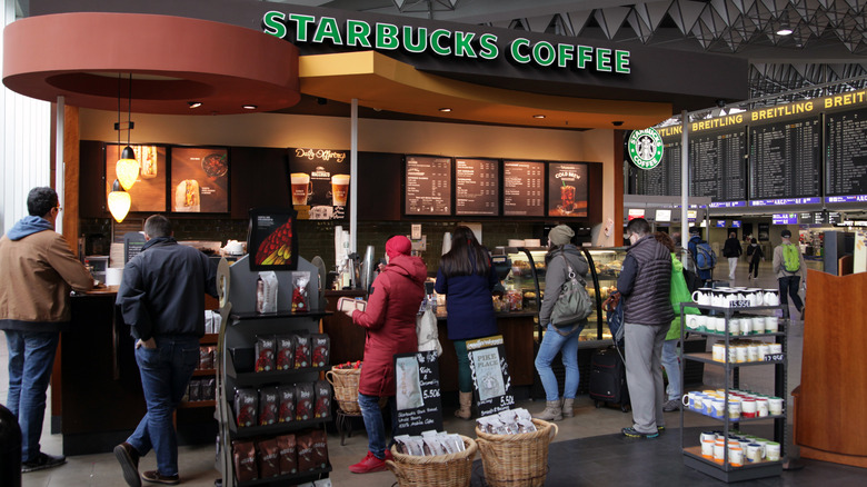 Passengers waiting in line at Starbucks