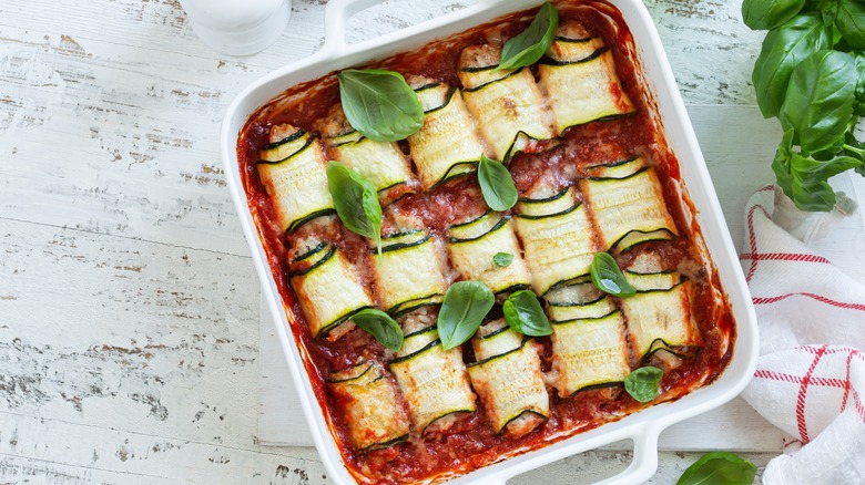 Rolled up zucchini lasagna with tomato sauce