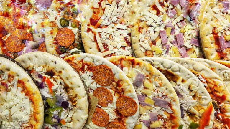 Various frozen pizzas.