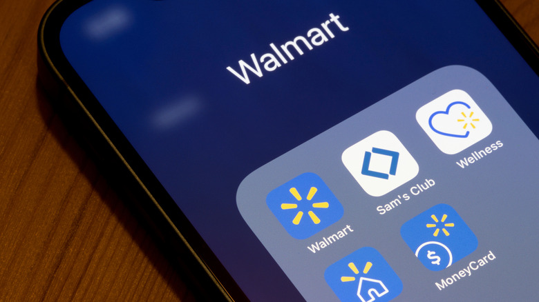 A phone with a folder labeled Walmart has different Walmart apps, including Sam's Club