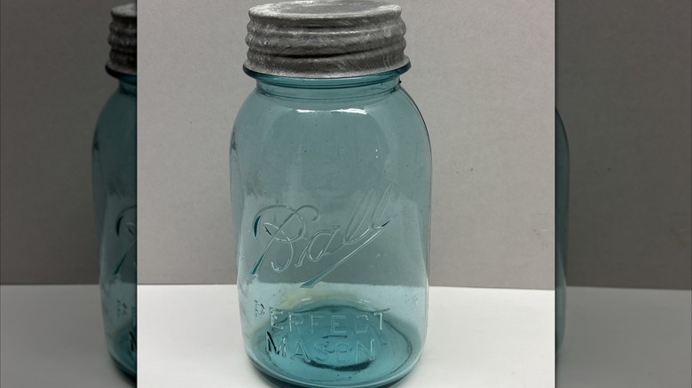 Individual blue Ball #13 mason jar with zinc lid on table
