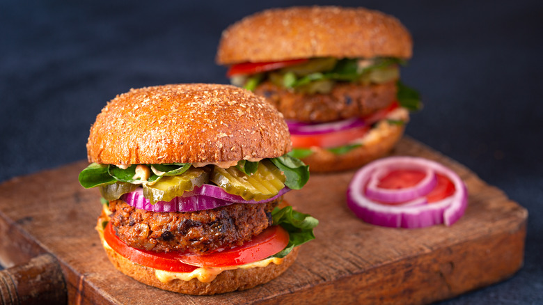 Black bean burgers on wooden cutting board