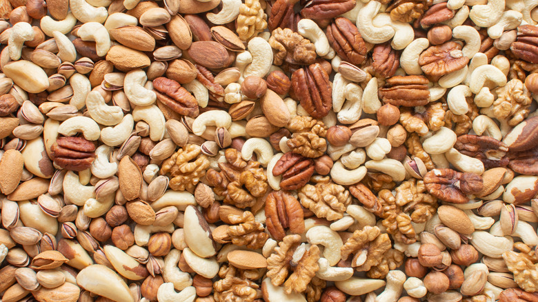 A mixture of nuts covers an entire surface