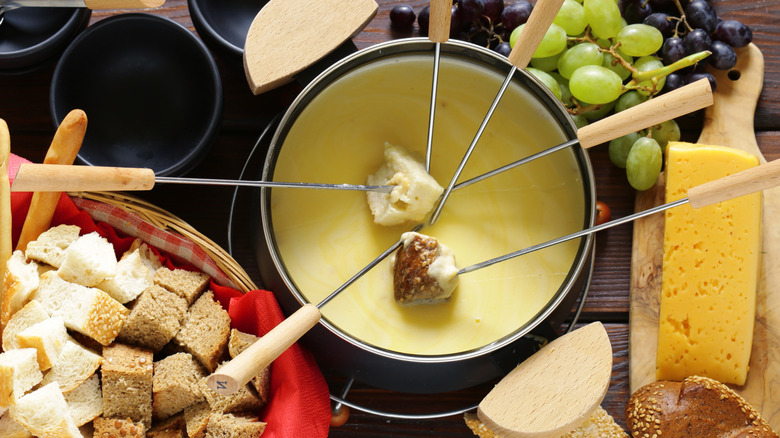 Fondue surrounded by dippers