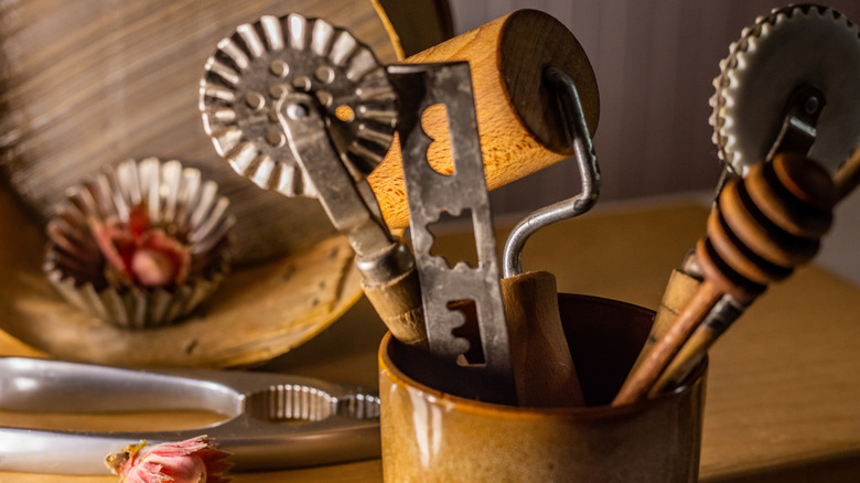 Old school baking utensils in a container