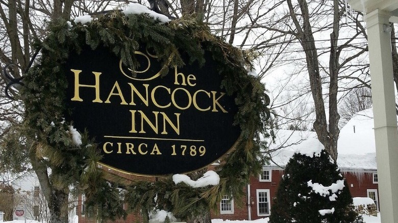 Snow-covered wreath adorning a sign for The Hancock Inn