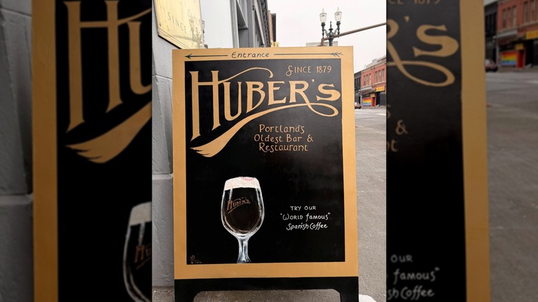Sandwich board directing customers to Huber's for a "World Famous" Spanish coffee
