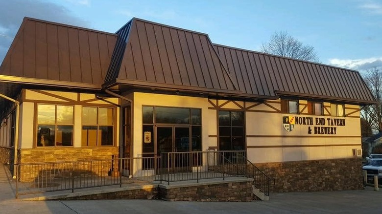 Exterior of the North End Tavern & Brewery lit by the setting sun