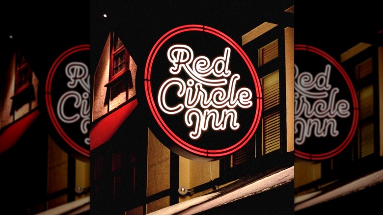 Neon red and white sign advertising the Red Circle Inn
