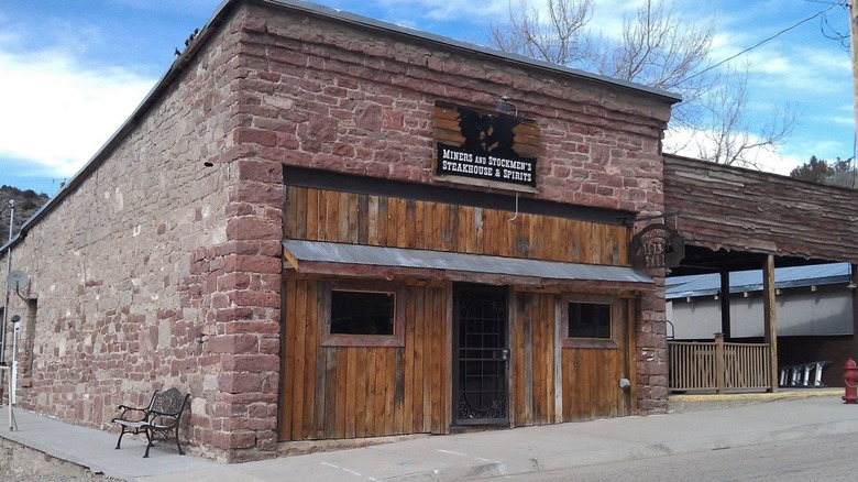 Weather stone and wood exterior of Miners and Stockmen's Steakhouse