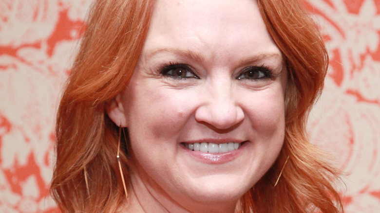 Ree Drummond in front of floral background