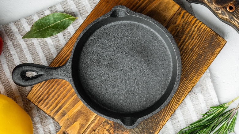 Cast iron skillet on wooden platter