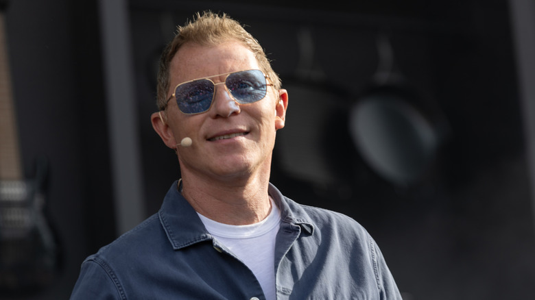Bobby Flay presenting at a food event.