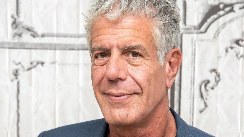 Anthony Bourdain close up with slight smile 