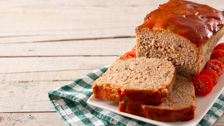 Meatloaf on a rustic wooden table.
