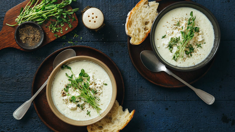 creamy cauliflower soup with herbs and bread
