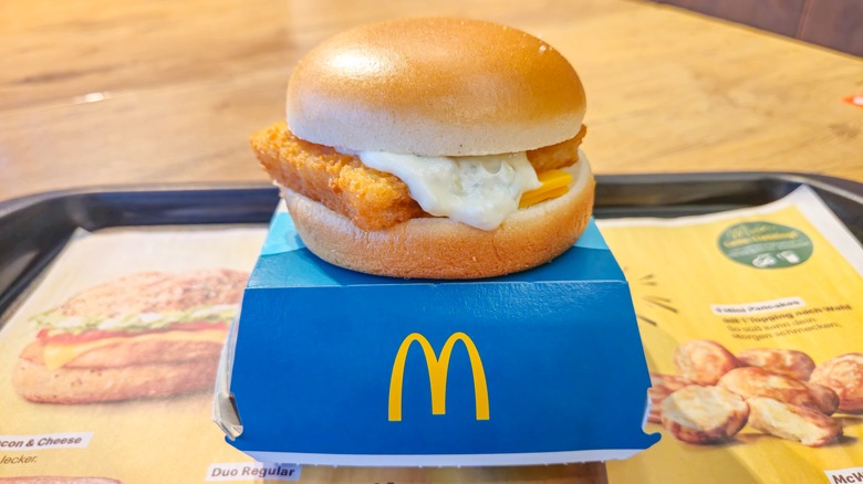 A Filet-O-Fish on top of a McDonald's container