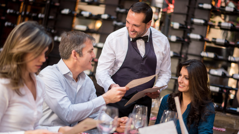 man ordering from menu 