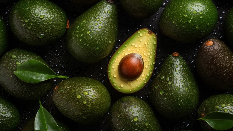 a pile of fresh avocados