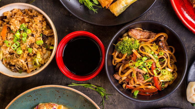 Soy sauce alongside Chinese dishes.