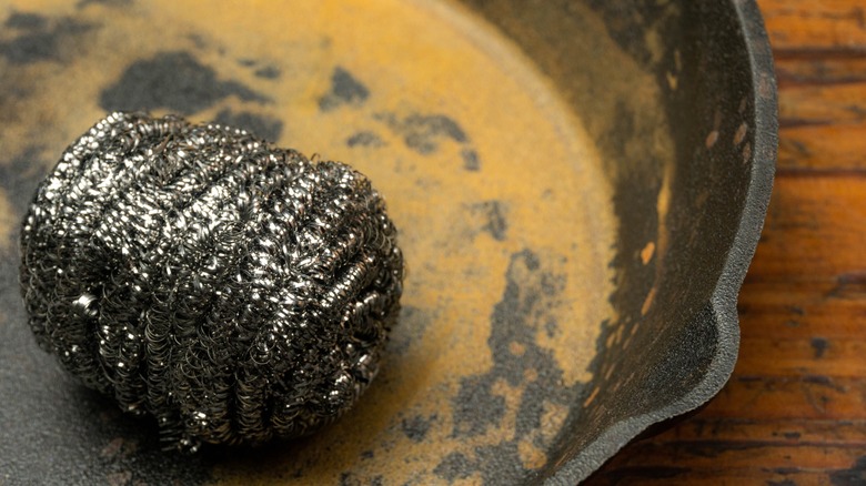A steel wool scrub on a cast iron pan