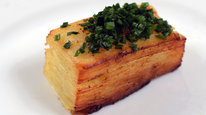 Pavé potatoes with chives on top