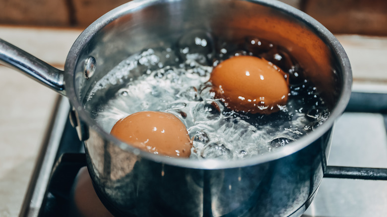 Pot of boiling water with eggs