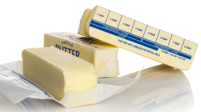 four sticks of butter with one unwrapped