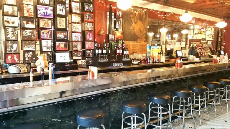 The interior bar area of the Original Oyster House in Pittsburgh glows