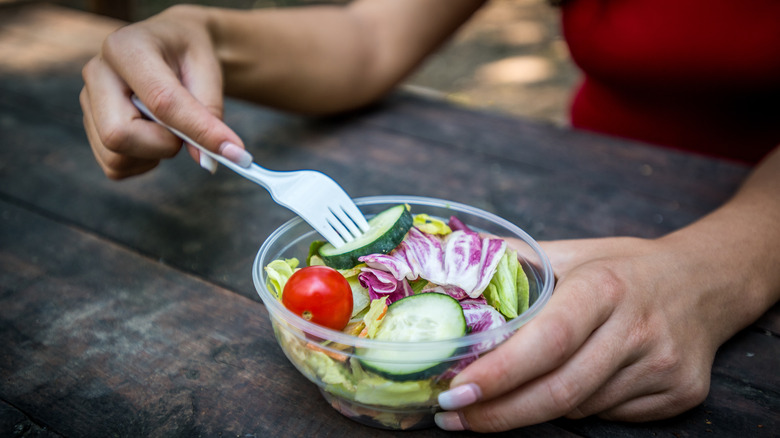 Plastic fork in salad bowl