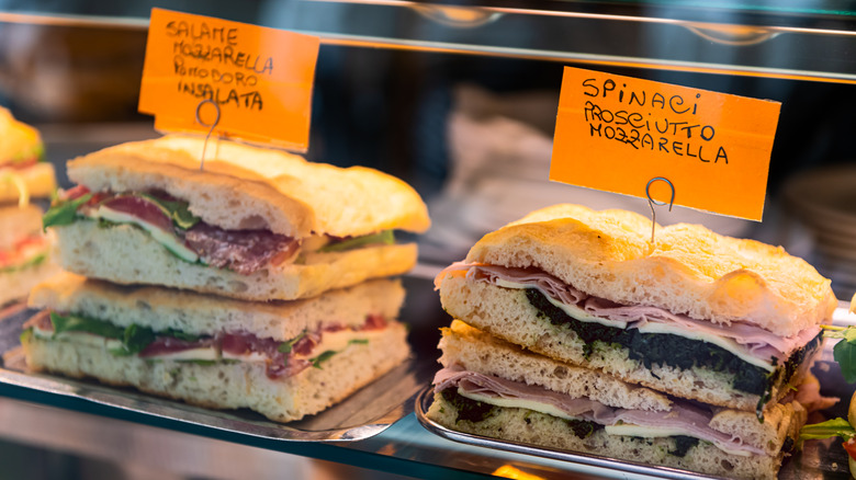Display closeup of Italian sandwiches in a bar